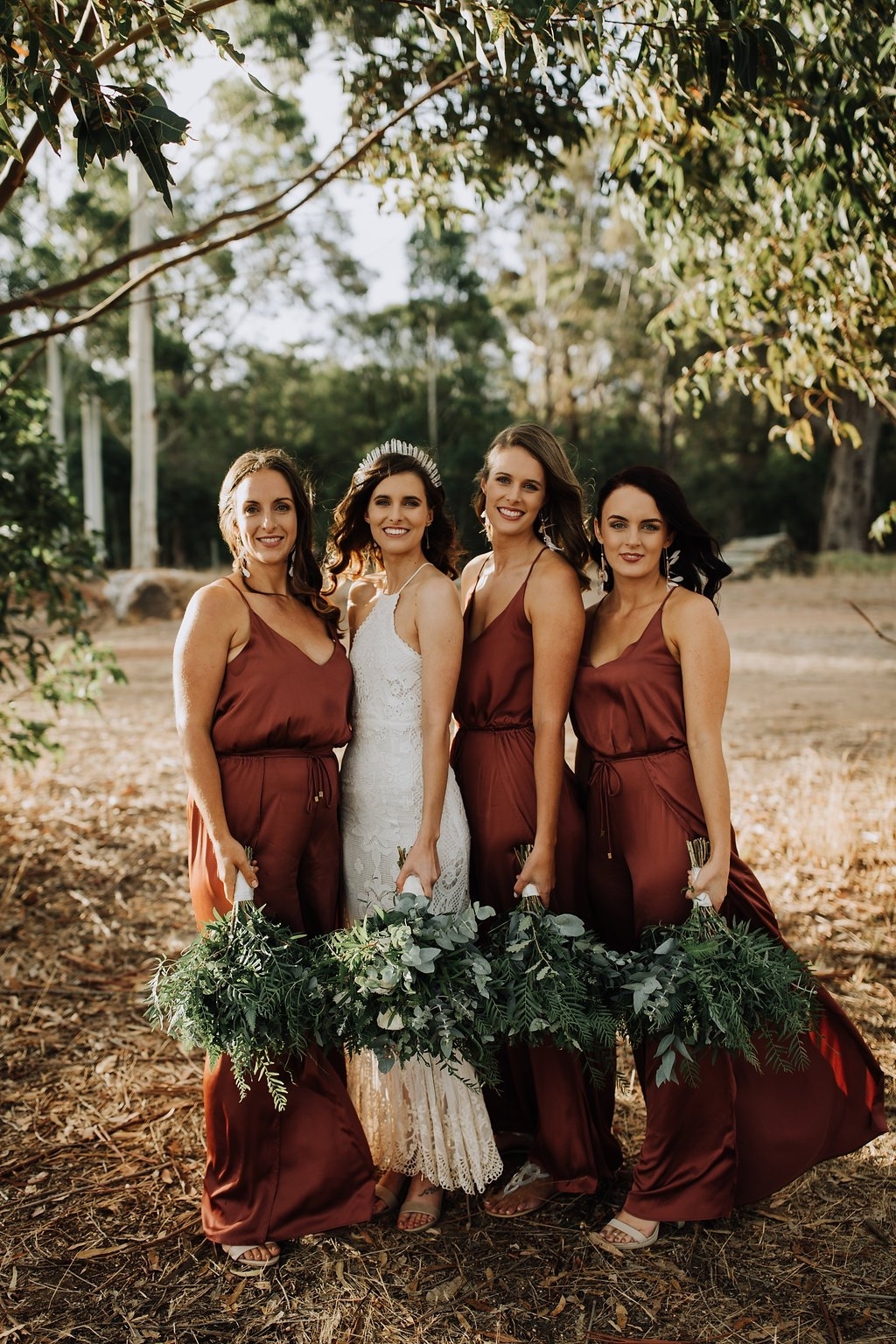 rust bridesmaid dresses and white bridal gown for navy gold and rust wedding color combo