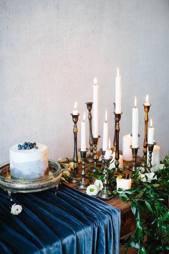 navy blue and teal tablescape and gold candle holders for navy gold and dark teal wedding color combo