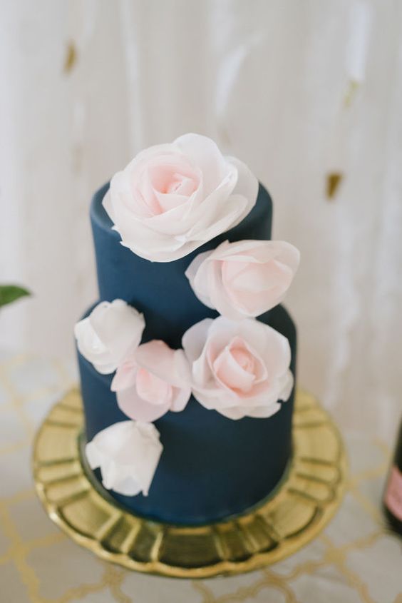navy blue wedding cake with blush flowers for navy gold and blush wedding color combo