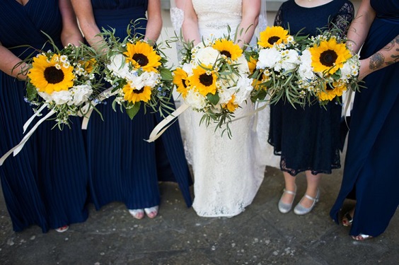 navy blue bridesmaid dresses yellow bouquets
