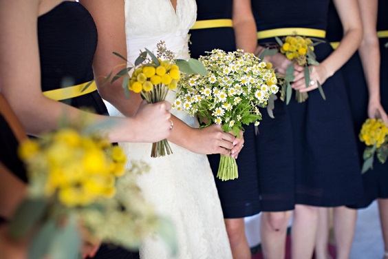 navy blue bridesmaid dresses yellow white bouquets