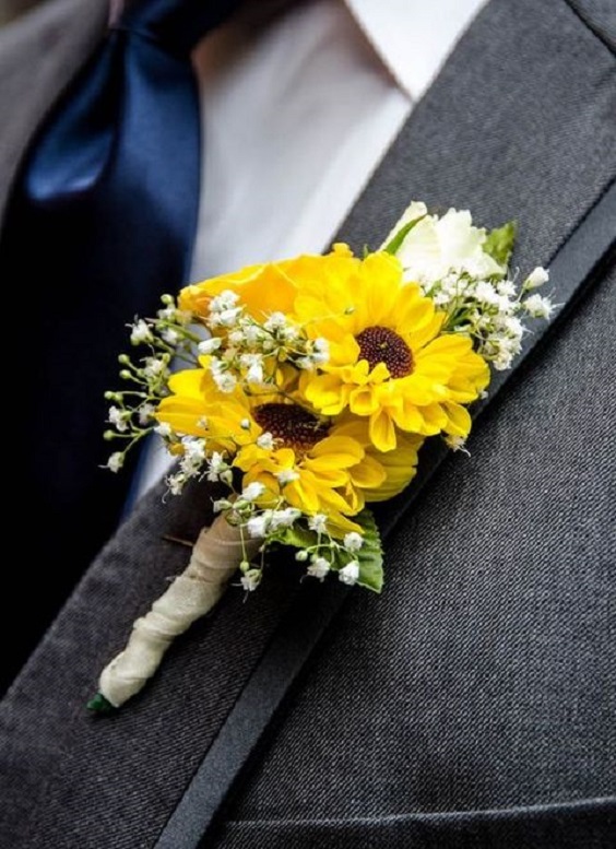 yellow boutonniere and gray grooms attire