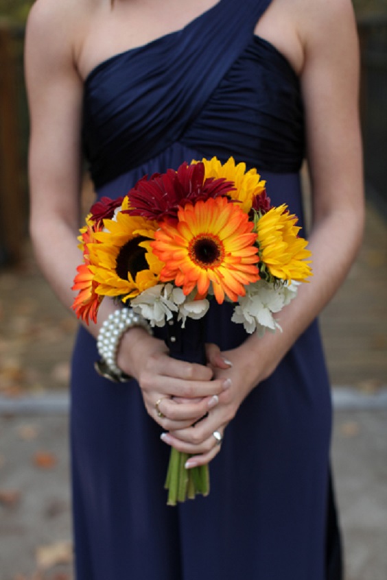 navy blue bridesmaid dresses orange yellow bouquets
