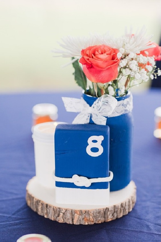 navy blue wedding table number with coral flowers for navy blue and coral wedding color beach