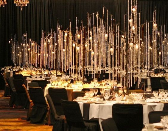 black chairs gold arrangements overhead for rustic goth black and gold wedding