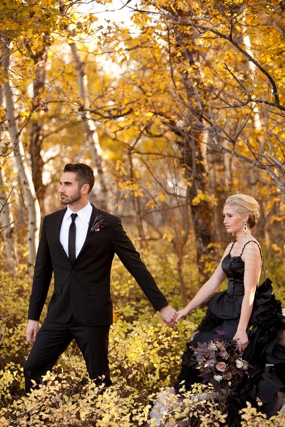 black bridal gown and groom suit for spring black and gold wedding