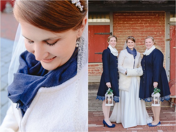 white bridal gown and navy bridesmaid dresses for winter wedding in country barn
