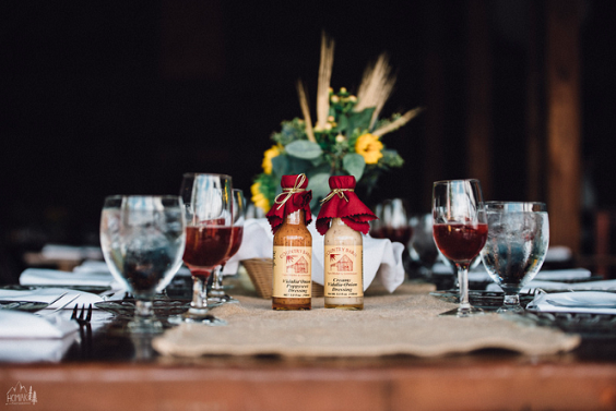 wooden table and centerpiece for fall wedding in country barn