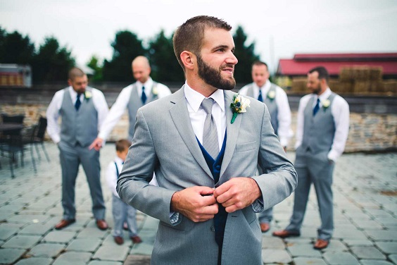 grey mens suit for summer wedding in country barn