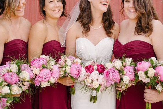 burgundy bridesmaid dresses and pink bouquets for burgundy and pink wedding in country barn