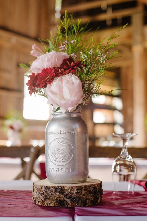 wedding centerpiece for burgundy and pink wedding in country barn