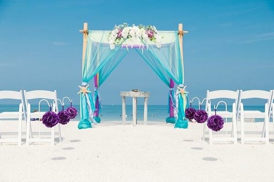 mauve wedding chair flowers and teal ceremony arch for mauve and teal simple beach wedding