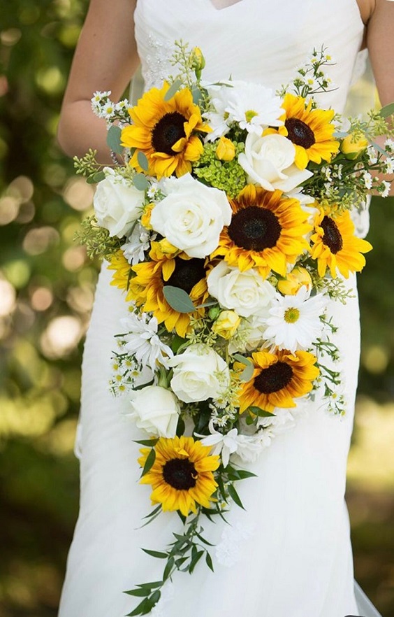 bridesmaid with yellow and green wedding bouquets for yellow and green simple beach wedding