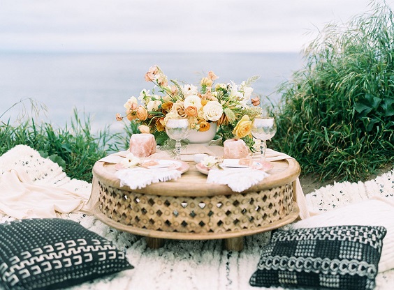 wedding table setting with yellow flowers and greenery decorations for yellow and green simple beach wedding