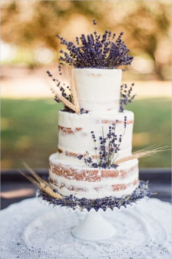 naked wedding cake dotted with lavender and wheat for rustic outdoor wedding colors lavender and wheat