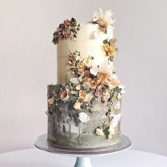 sage green and white wedding cake with terracotta flowers for rustic outdoor wedding colors sage green and terracotta