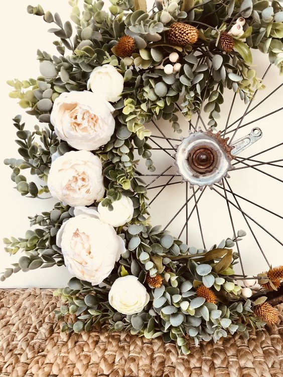 white and sage green wheel wreath for rustic outdoor wedding colors sage green and terracotta