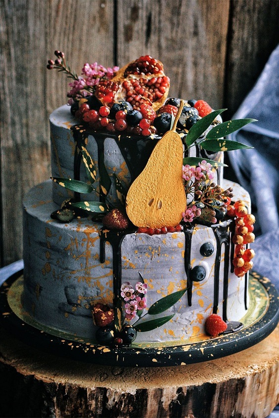 grey blue wedding cake dotted with fruits for rustic outdoor wedding colors sunset