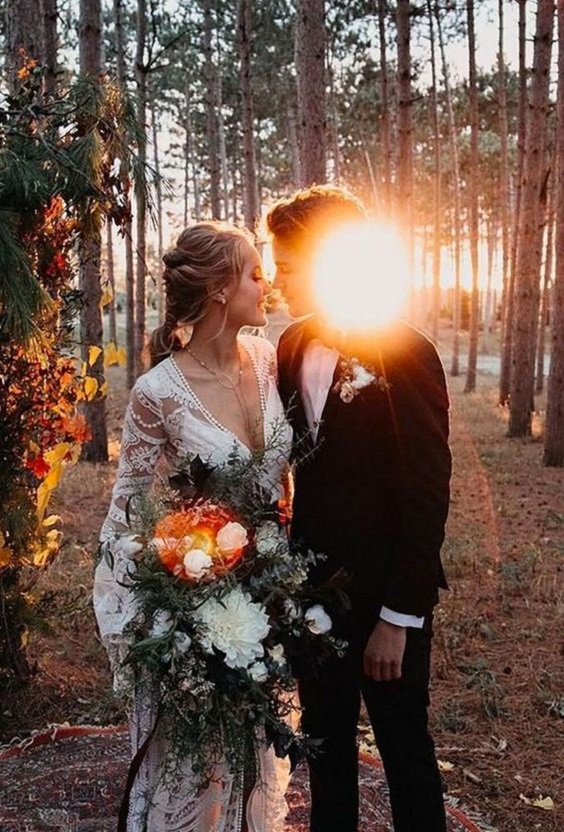 white lace bridal gown and black mens suit for rustic outdoor wedding colors sunset