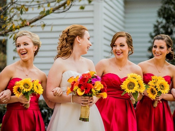 red bridesmaid dresses with sunflower bouquets for sunflower and rose wedding sunflower and red rose