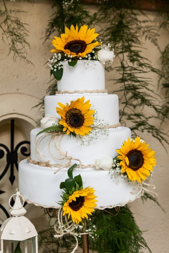 white wedding cake dotted with sunflower for sunflower and rose wedding sunflower and white rose