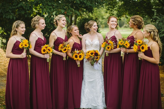 burgundy bridesmaid dresses with sunflower bouquets for sunflower and rose wedding sunflower and burgundy rose