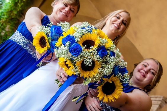 royal blue bridesmaid dresses with royal blue roses and sunflower bouquets for sunflower and rose wedding sunflower and royal blue rose