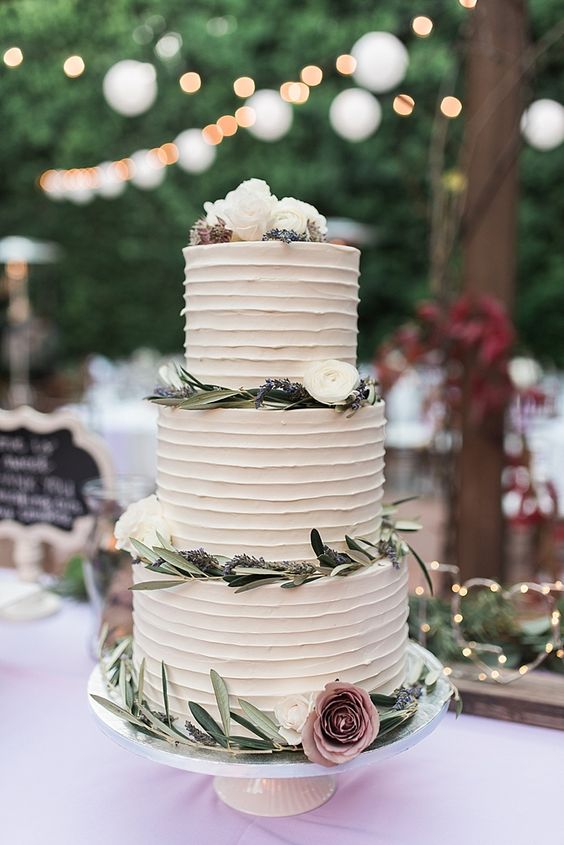 wedding cake with mauve flower and greenery decorations for mauve and green country chic wedding