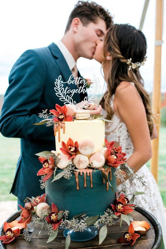 teal wedding cake with orange flowers decorations for teal and orange country chic wedding