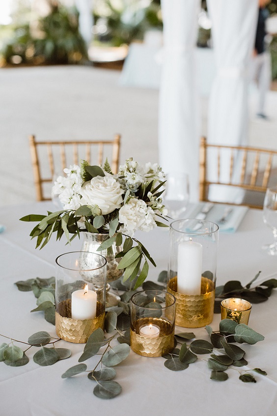 gold chairs and gold white table decorations for gold white rustic elegant wedding