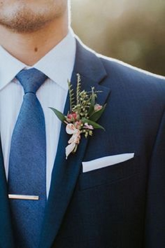 navy blue grooms attire and blush boutonniere for navy blue blush rustic elegant wedding