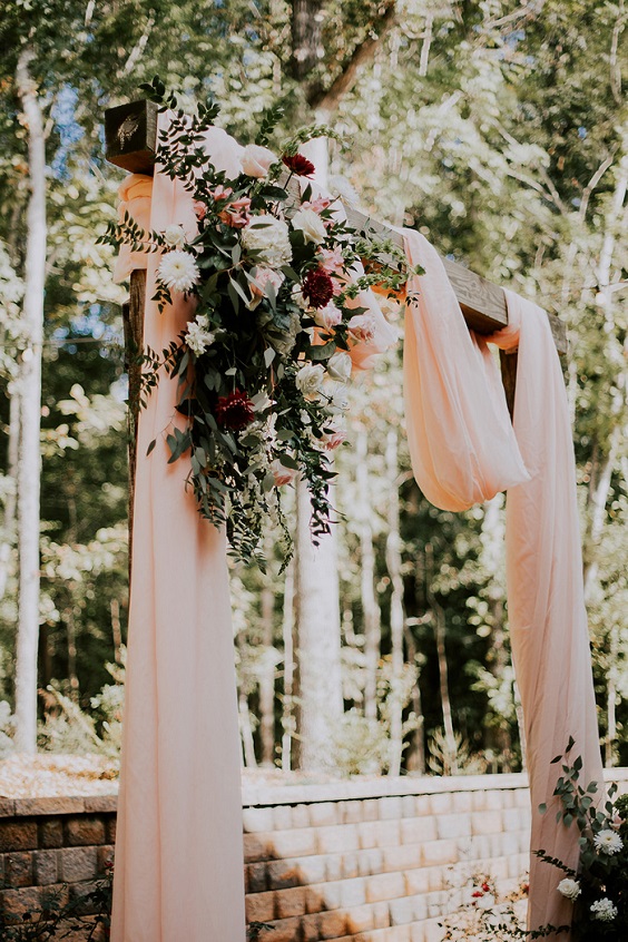 ceremony arch for white barn wedding colors white and light pink