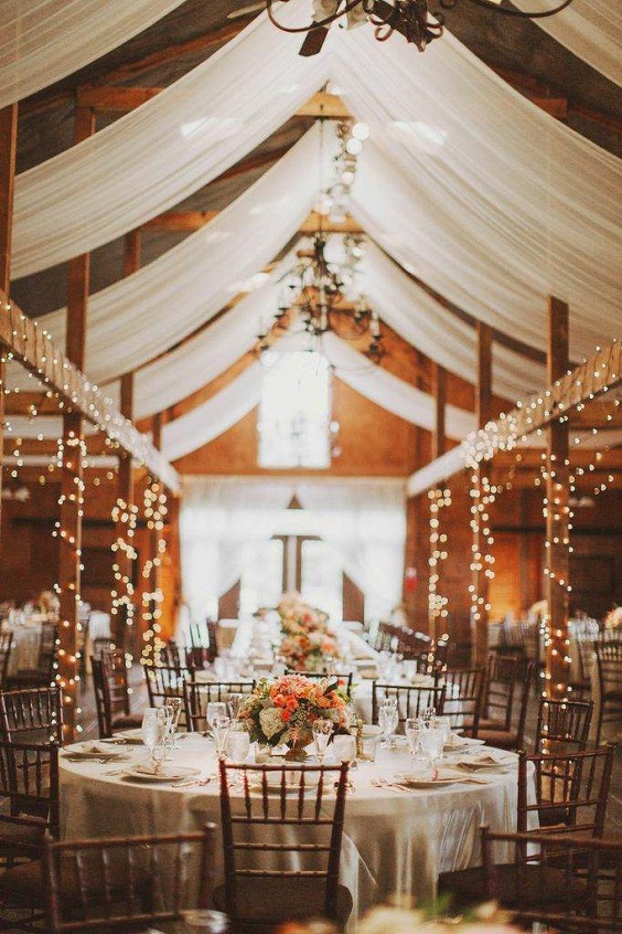 barn wedding with lights and fabric for white barn wedding colors white and beige