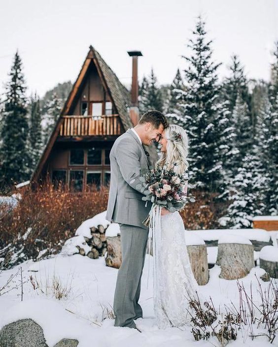 white bridal gown and light grey mens suit for white barn wedding colors white brown and black