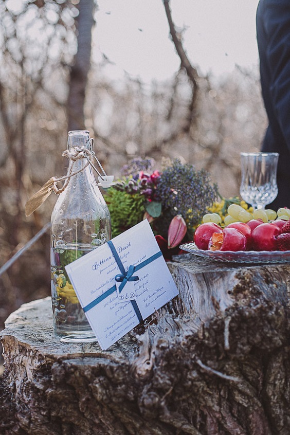 table decor and wedding stationery for blue yellow green outdoor winter wedding