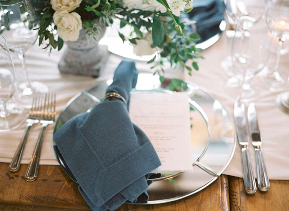 navy blue table cloth and green table garland for navy blue green outdoor winter wedding