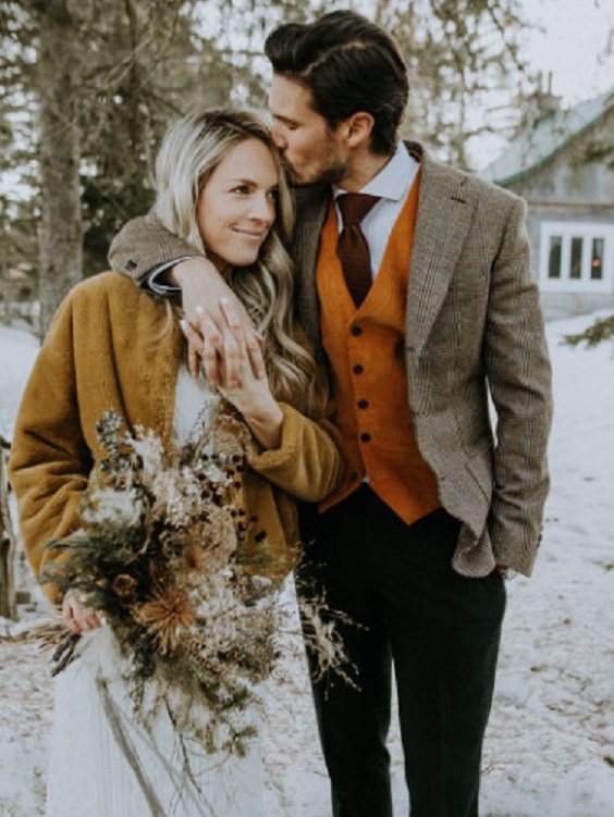 orange groon vest and yellow bridal shawl for orange yellow outdoor winter wedding