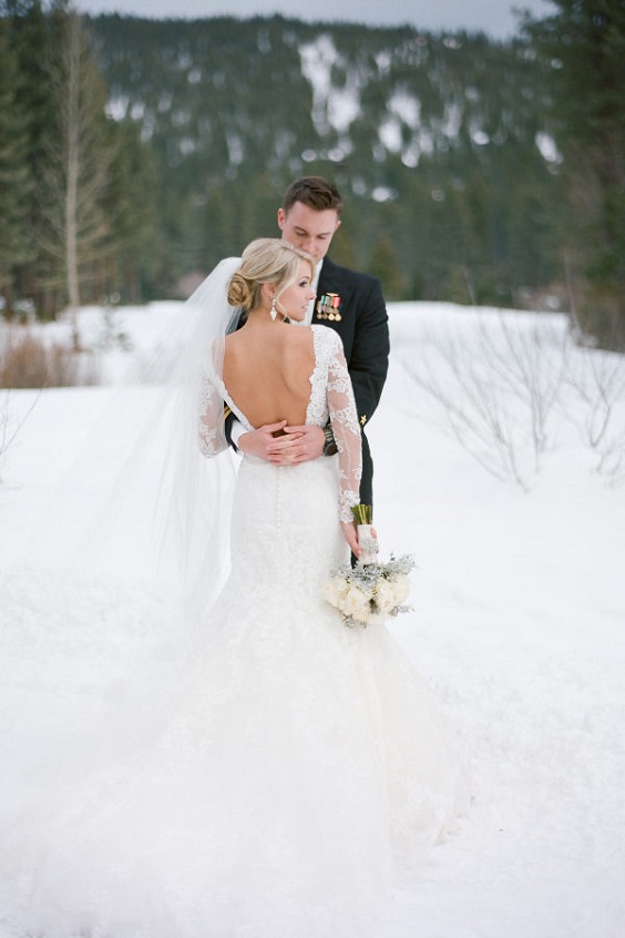 white bridal gown cream bouquets for white cream outdoor winter wedding