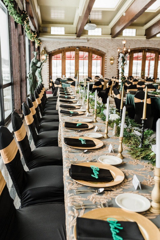 black wedding napkin and greenery tablescape for winter wonderland wedding color emerald green and black
