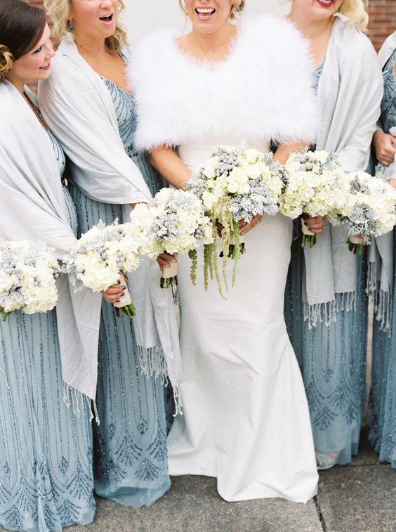 ice blue bridesmaid dresses and white bridal gown for winter wonderland wedding color ice blue and dusty blue