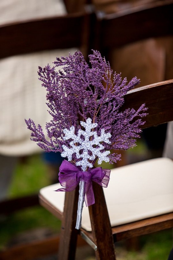 purple flower and snowflake decoration in wedding chair for winter wonderland wedding color purple and lavender