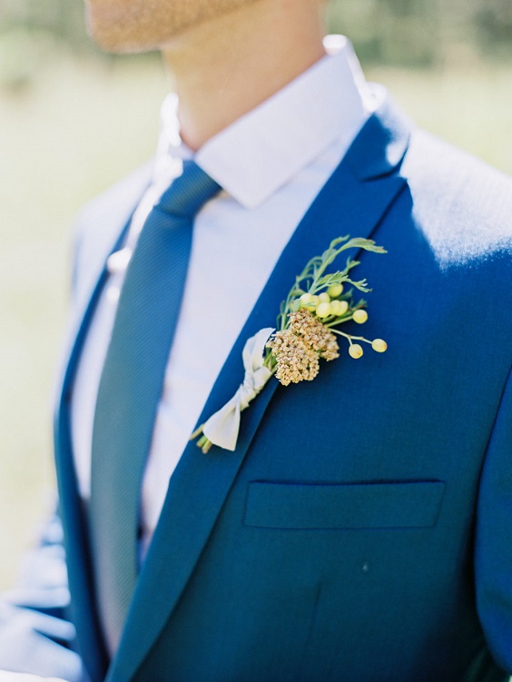 blue men tie suit yellow boutonniere for blue yellow red blue and yellow wedding