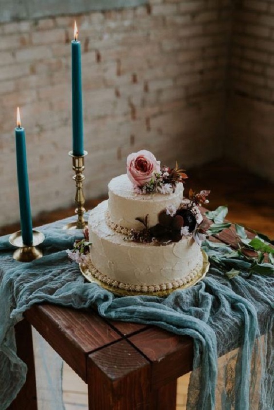 dark teal wedding table candles and cake with dusty rose flowers for dark teal and dusty rose vintage rose wedding