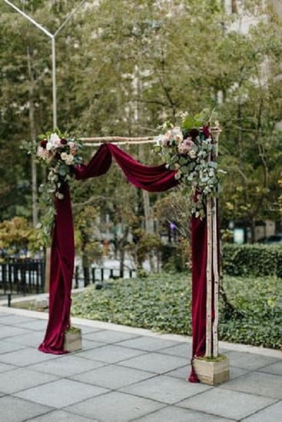 burgundy wedding ceremony arch for burgundy rose gold and burgundy wedding