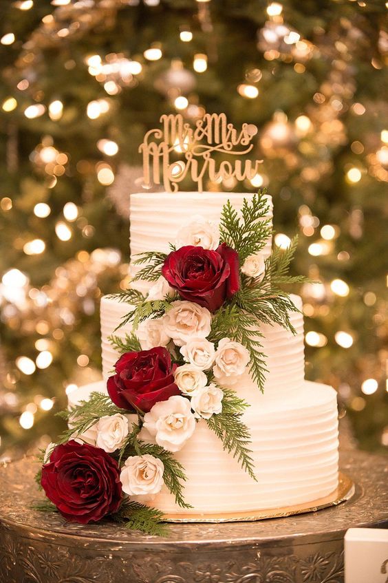 white wedding cake red flowers and gold decorations for gold red and white wedding