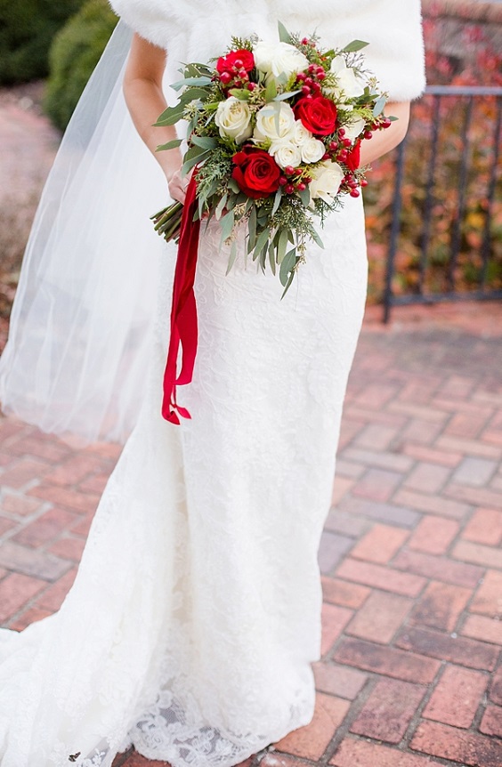 white wedding dress with red bouquets for rustic red and white wedding