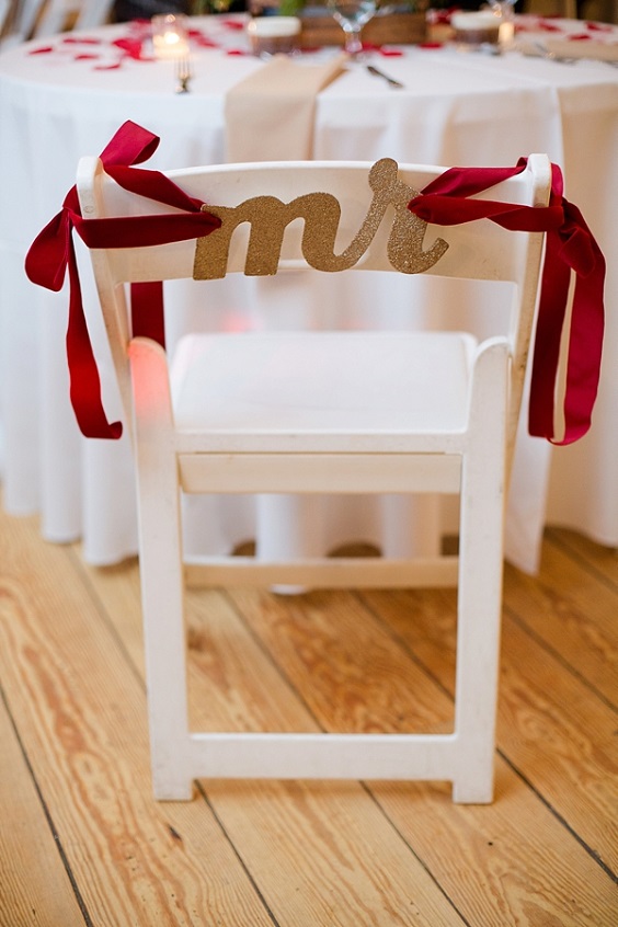 white wedding table chair with red ribbons decorations for rustic red and white wedding