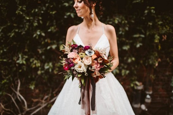 white bridal gown and bouquet for maroon and navy wedding colors maroon navy and peach