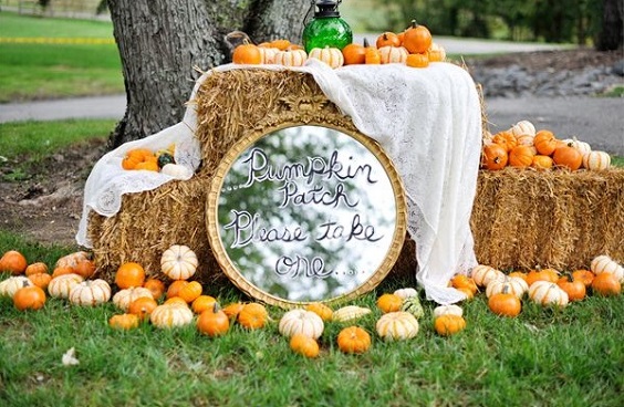 hay bale and pumpkins for maroon and navy wedding colors maroon navy and orange