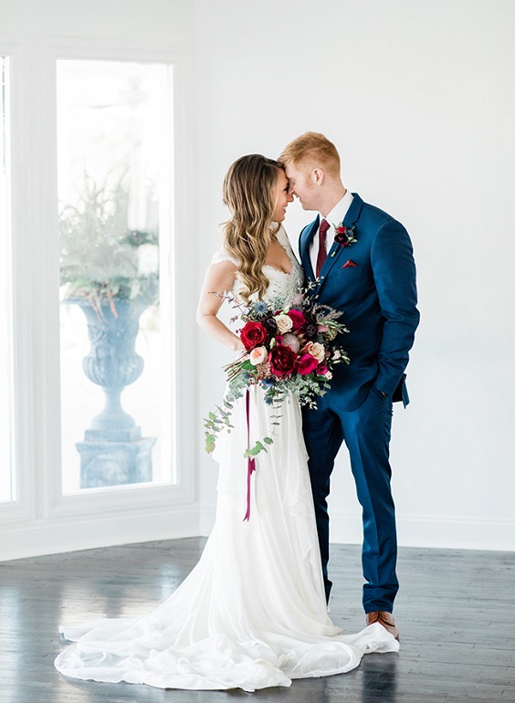 navy blue groom suit white bridal gown burgundy bouquet for burgundy and navy wedding color spring